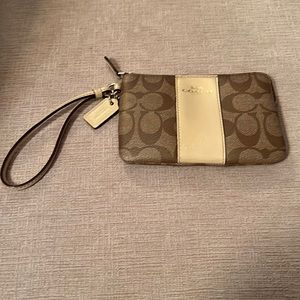 Coach tan wristlet with zipper closure 6” x 4”